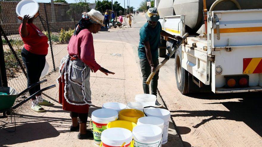 Residents wait to get clean drinking water from tankers in Tshwane