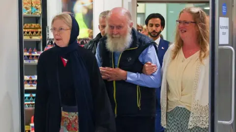British Couple Rescued from Taliban Detention Returns Home
