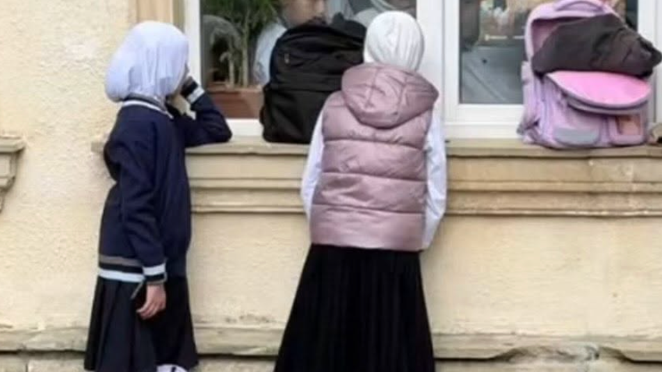 Students outside a school in Baku protest headscarf ban