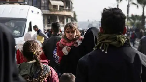 Civilians Flee Escalating Clashes in Aleppo Amid Syrian-Kurdish Tensions