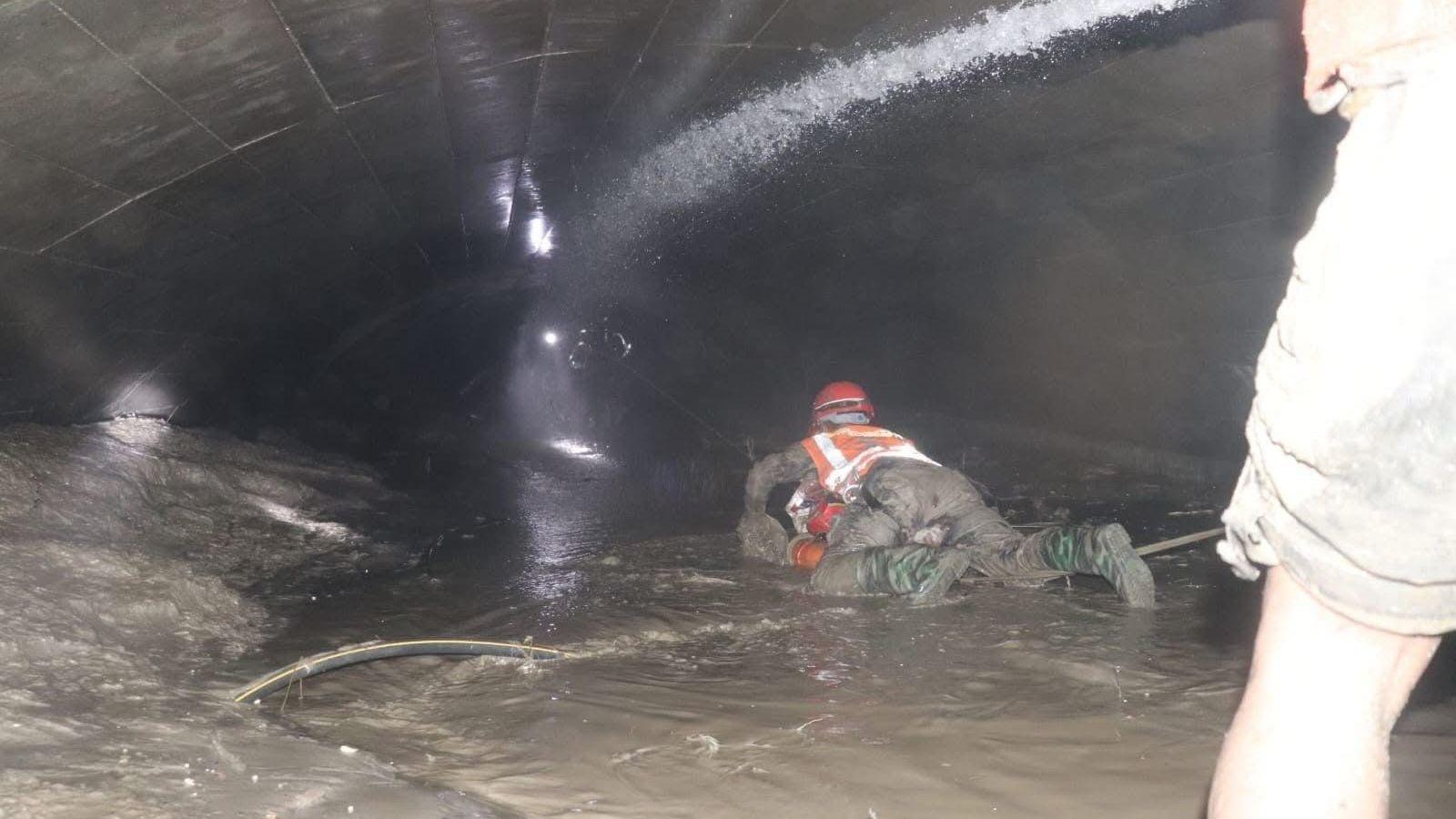 Nine Days After the Flood: Nepal Rescuers Crack Through a Tunnel to Save Workers