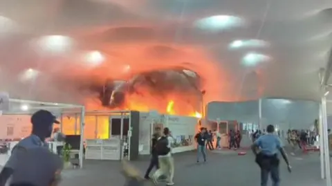 COP30 Climate Talks Encounter Major Disruption as Fire Forces Evacuation