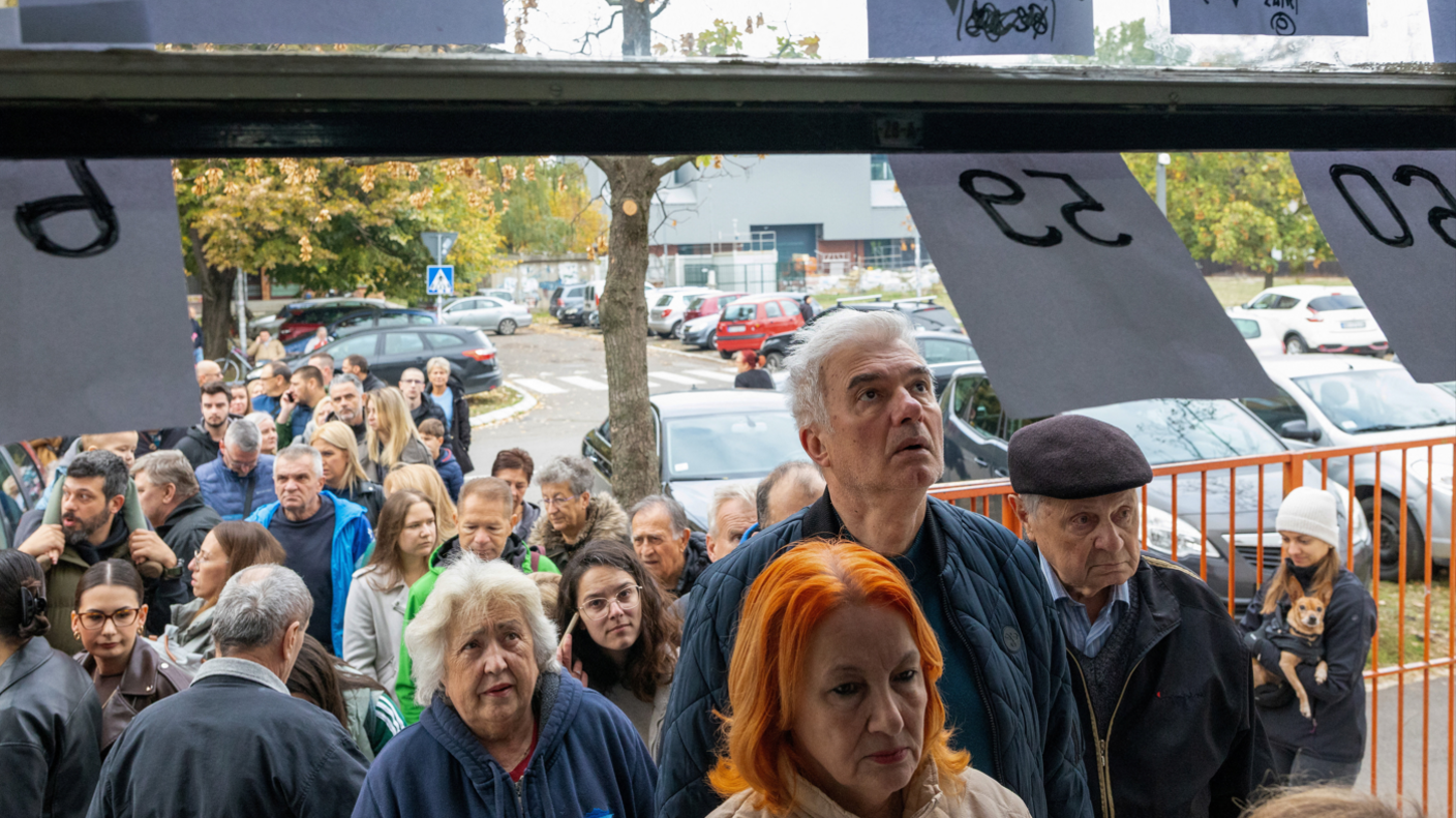 People queue outside a polling station in Novi Sad during the parliamentary election